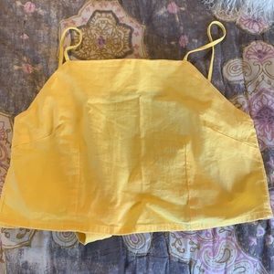 Yellow top with adjustable straps and ties in the back